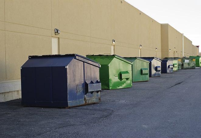 large construction dumpster positioned on a city street in Canon City CO